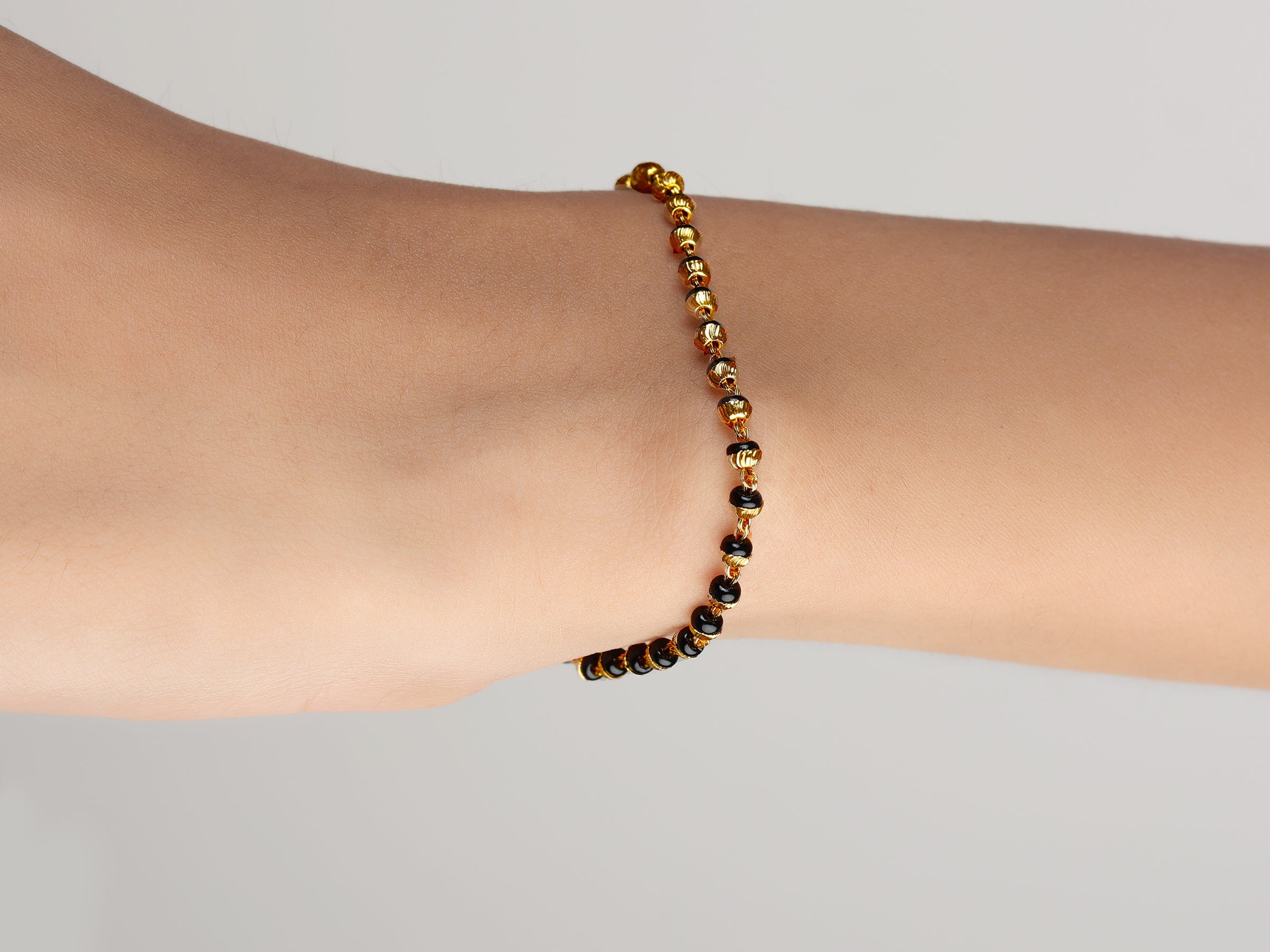 JHB Golden Gold-Plated Brass Bracelet 2 pis Combo for Women (Golden Bead Bracelet + Black Bead Hand Mangalsutra Bracelet)